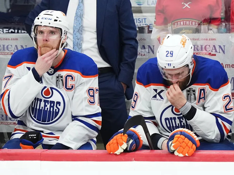  Edmonton Oilers captain Connor McDavid, left, and centre Leon Draisaitl react to a Florida Panthers empty-net goal during the third period in Game 6 of the Stanley Cup final in Sunrise, Fla., on Tuesday.