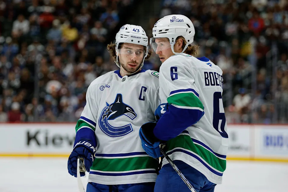 Vancouver Canucks defenseman Quinn Hughes (43) and right wing Brock Boeser (6) talk during a stoppage of play.Isaiah J. Downing-Imagn Images