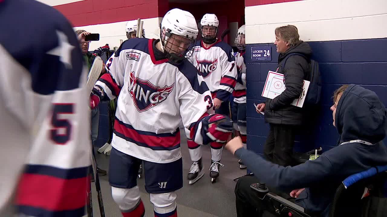 Minnesota teen defies odds, reunites with hockey team after paralysis