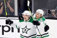 Dallas Stars center Roope Hintz (24) celebrates left wing Jason Robertson’s (21) second...