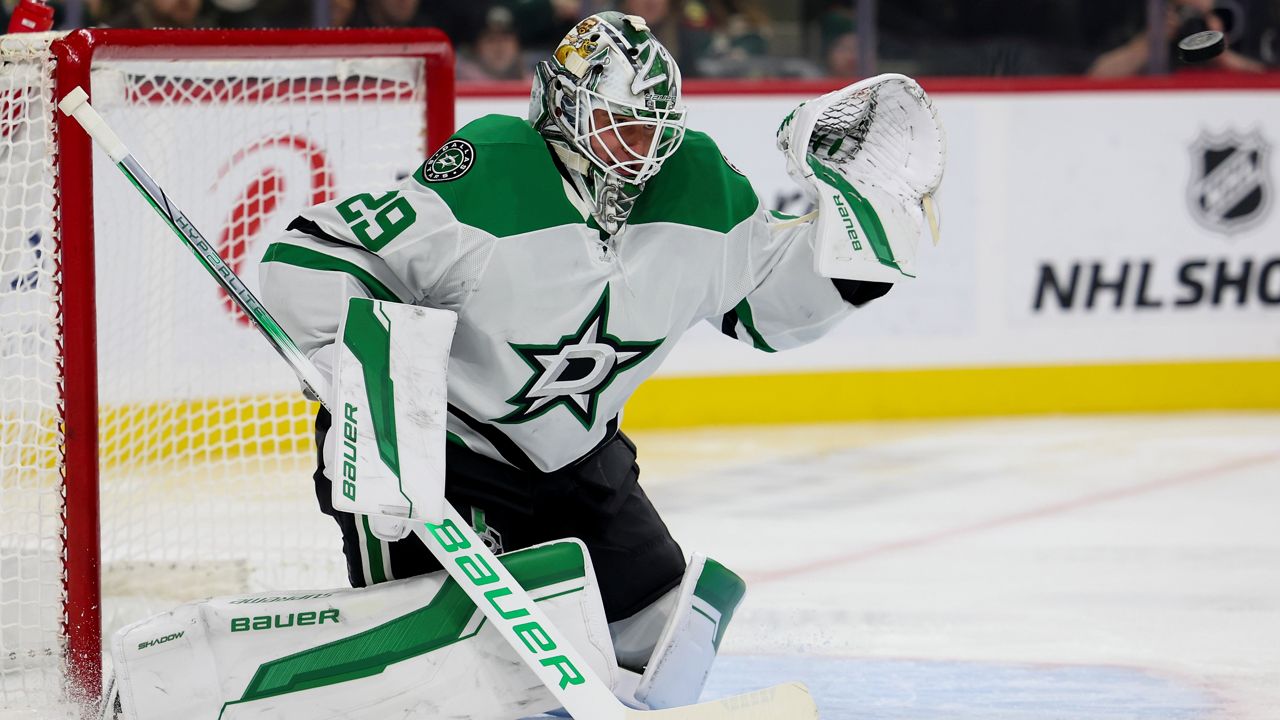 Dallas Stars goaltender Jake Oettinger prepares to save the puck during the first period of an NHL hockey game against the Minnesota Wild, Saturday, Nov. 16, 2024, in St. Paul, Minn. (AP Photo/Ellen Schmidt)