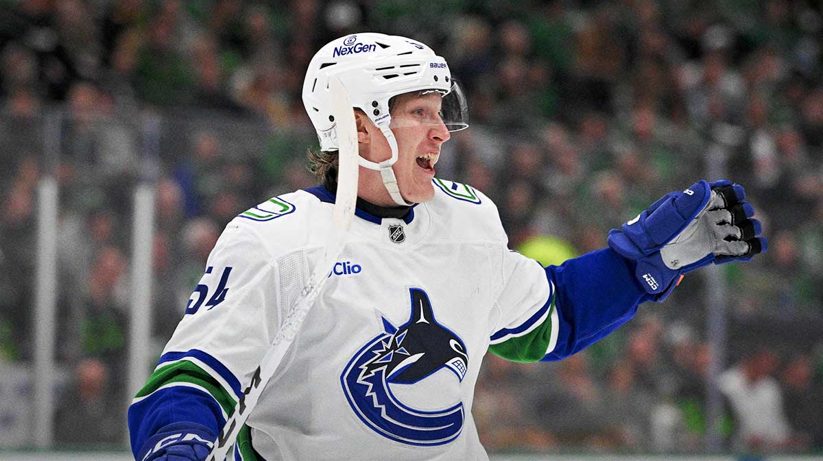 Vancouver Canucks center Aatu Raty (54) celebrates a goal scored by defenseman Victor Mancini (not pictured) against the Dallas Stars during the third period at the American Airlines Center.