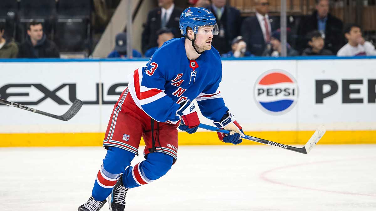New York Rangers left wing Alexis Lafreniere (13) skates against the Vancouver Canucks during the third period at Madison Square Garden.