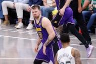 Los Angeles Lakers guard Luka Doncic (77)  looks back at Dallas Mavericks forward P.J....