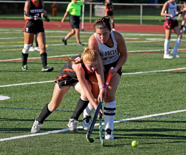Beverly's Fiona Bazin, left, and Gloucester's Olivia Madruga battle for possession of the ball during Gloucester's 3-0 win. (Staff Photo By Stuart Cahill/Boston Herald)
