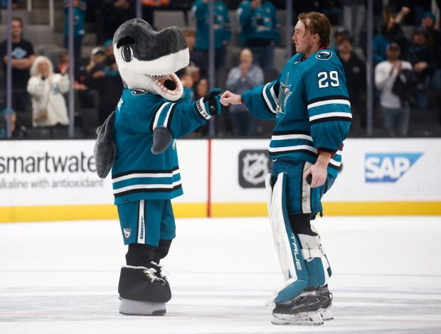 San Jose Sharks mascot SJ Sharkie fist bumps San Jose Sharks goaltender MacKenzie Blackwood (29) after their 3-2 win over the Edmonton Oilers at the SAP Center in San Jose, Calif., on Thursday, Nov. 9, 2023. (Nhat V. Meyer/Bay Area News Group)