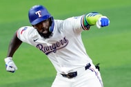 Texas Rangers batter Adolis García (53) celebrates his fifth inning double against the...