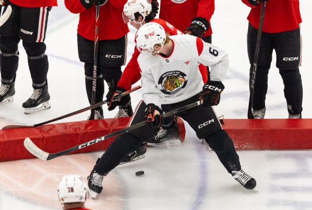 Chicago Blackhawks right defenseman Sam Rinzel checks a teammate during practice at the Fifth Third Arena in Chicago on Wednesday, Sept. 10, 2025. (Dominic Di Palermo/ Chicago Tribune)