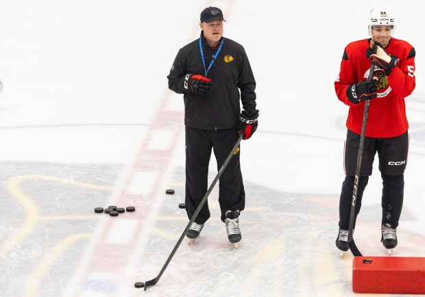 Rockford Ice Hogs head coach Jared Nightingale leads the Chicago Blackhawks in drills during practice at the Fifth Third Arena in Chicago on Wednesday, Sept. 10, 2025. (Dominic Di Palermo/ Chicago Tribune)
