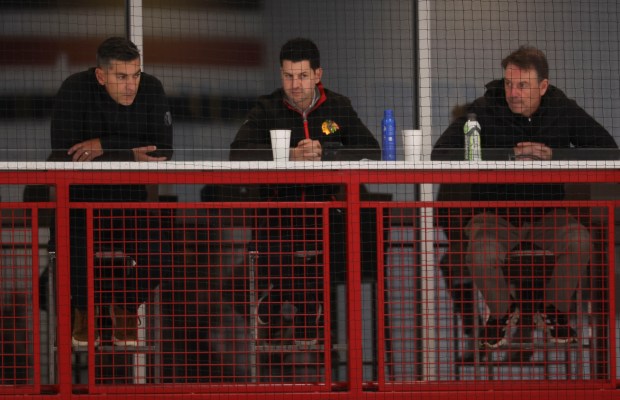 General manager Kyle Davidson, center, watches practice Thursday, Sept. 18, 2025, as the Chicago Blackhawks begin training camp at Fifth Third Arena. (Brian Cassella/Chicago Tribune)