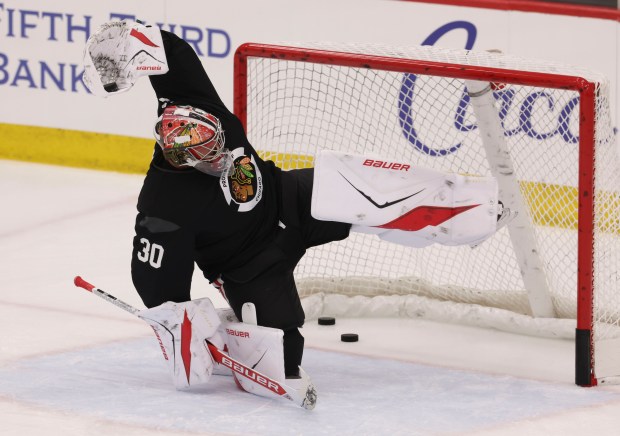 Goaltender Spencer Knight (30) practices Thursday, Sept. 18, 2025, as the Chicago Blackhawks begin training camp at Fifth Third Arena. (Brian Cassella/Chicago Tribune)