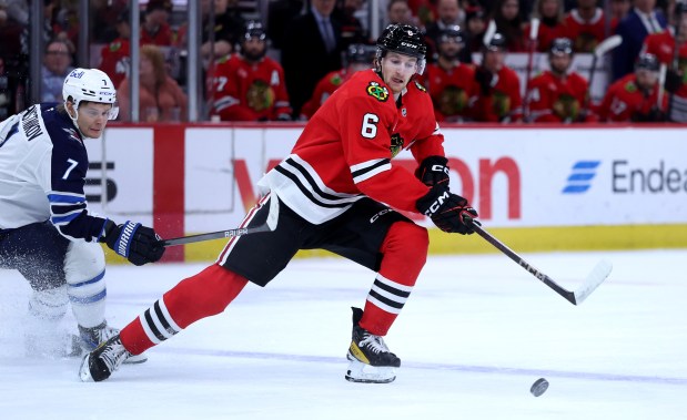 Blackhawks defenseman Sam Rinzel stays focused on the puck against the Jets on April 12, 2025, at the United Center. (Chris Sweda/Chicago Tribune)