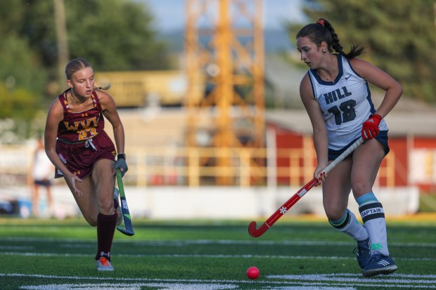 Wyoming Valley West’s Lily Watchilla, left, attempts to block The...