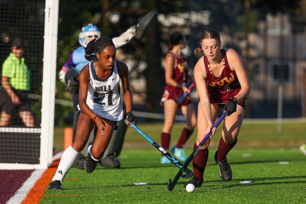 The Hill School’s (21) and Wyoming Valley West’s Savannah Rafuse...
