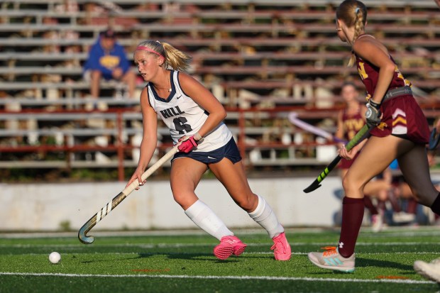 The Hill School’s Haley Elliott takes the ball down the...