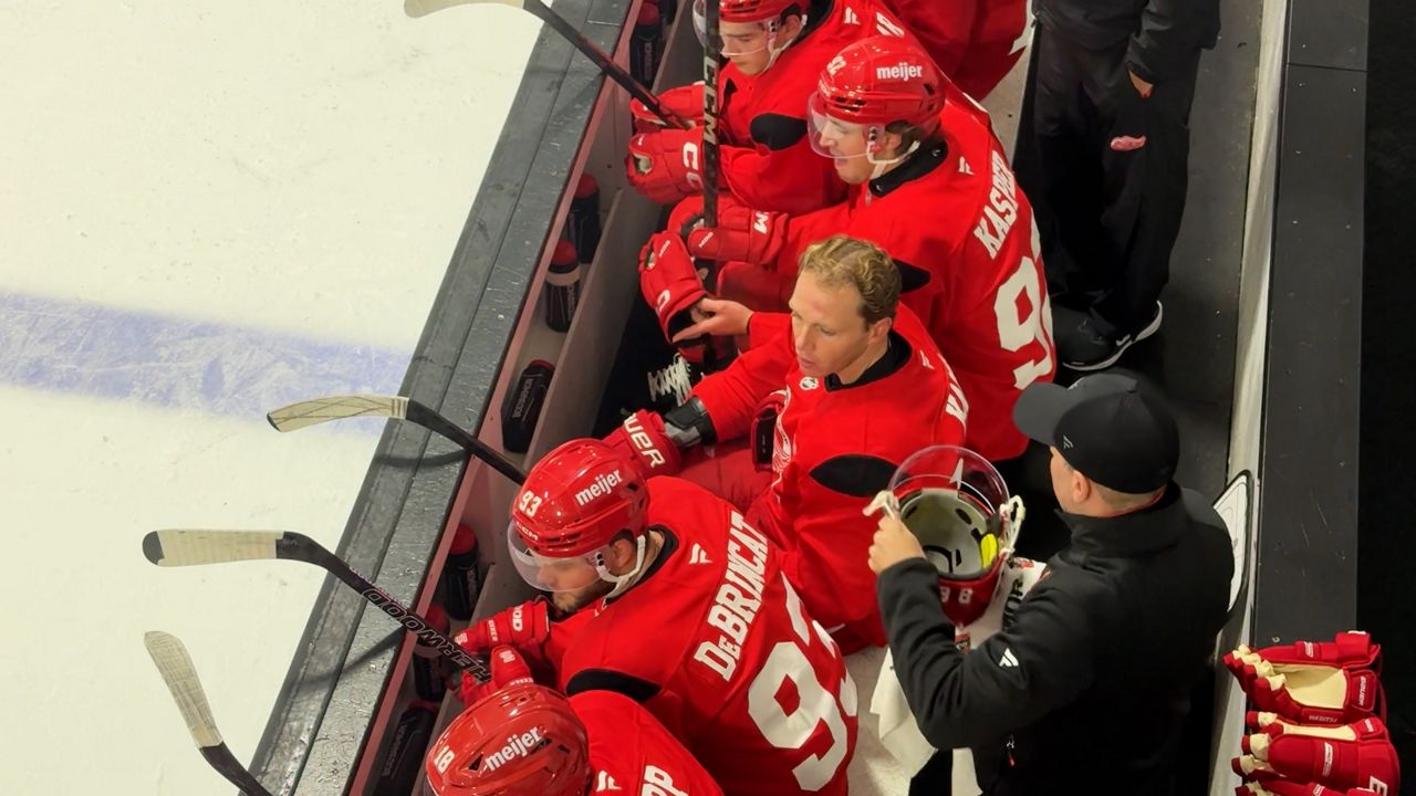Red Wings forwards Alex DeBrincat, Patrick Kane and Marco Kasper appear on the bench at Centre Ice Arena in Traverse City, Mich., in this image from Sept. 18, 2025. (Spectrum News/Jack Caron)