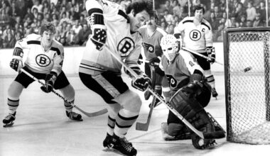 The Bruins' Phil Esposito took a shot on Flyers goalie Bernie Parent as teammates Bobby Orr, left, and John Bucyk, background right, looked on, on Nov. 22, 1973, at the Boston Garden.