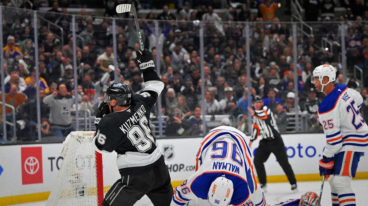 os Angeles Kings left wing Andrei Kuzmenko (96) battles past Edmonton Oilers defenseman Jake Walman (96) to score a goal in the second period of game 2 of the 2025 Stanley Cup Playoffs at Crypto.com Arena.