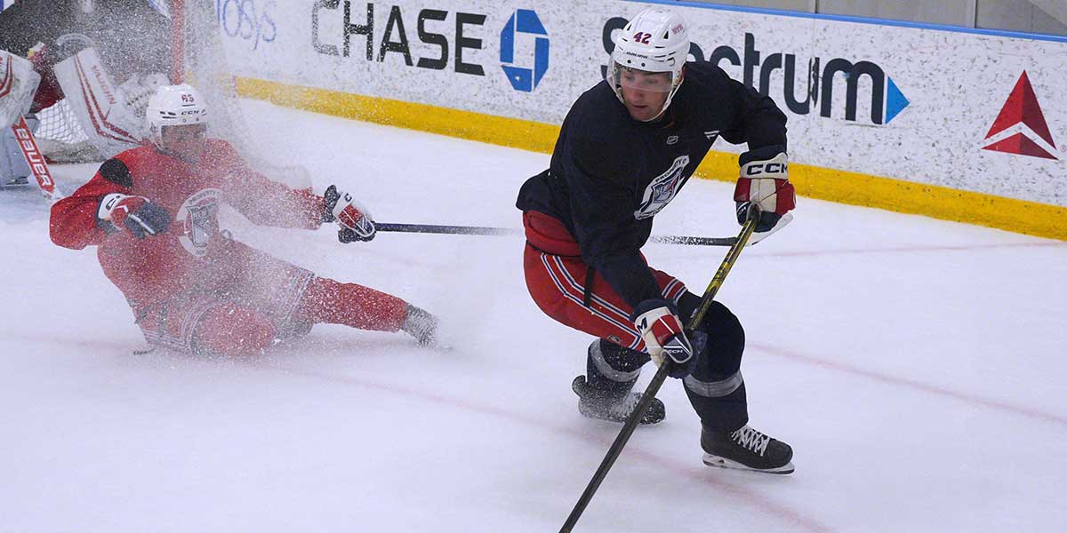 New York Rangers center Juuso Parssinen (71) moves the puck against Los Angeles Kings right wing Quinton Byfield (55) during the first period at Crypto.com Arena