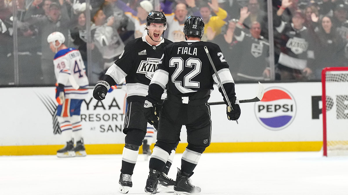 LA Kings left wing Kevin Fiala (22) celebrates with right wing Adrian Kempe (9) after scoring a goal in the third period of game one of the first round of the 2025 Stanley Cup Playoffs against the Edmonton Oilers at Crypto.com Arena.