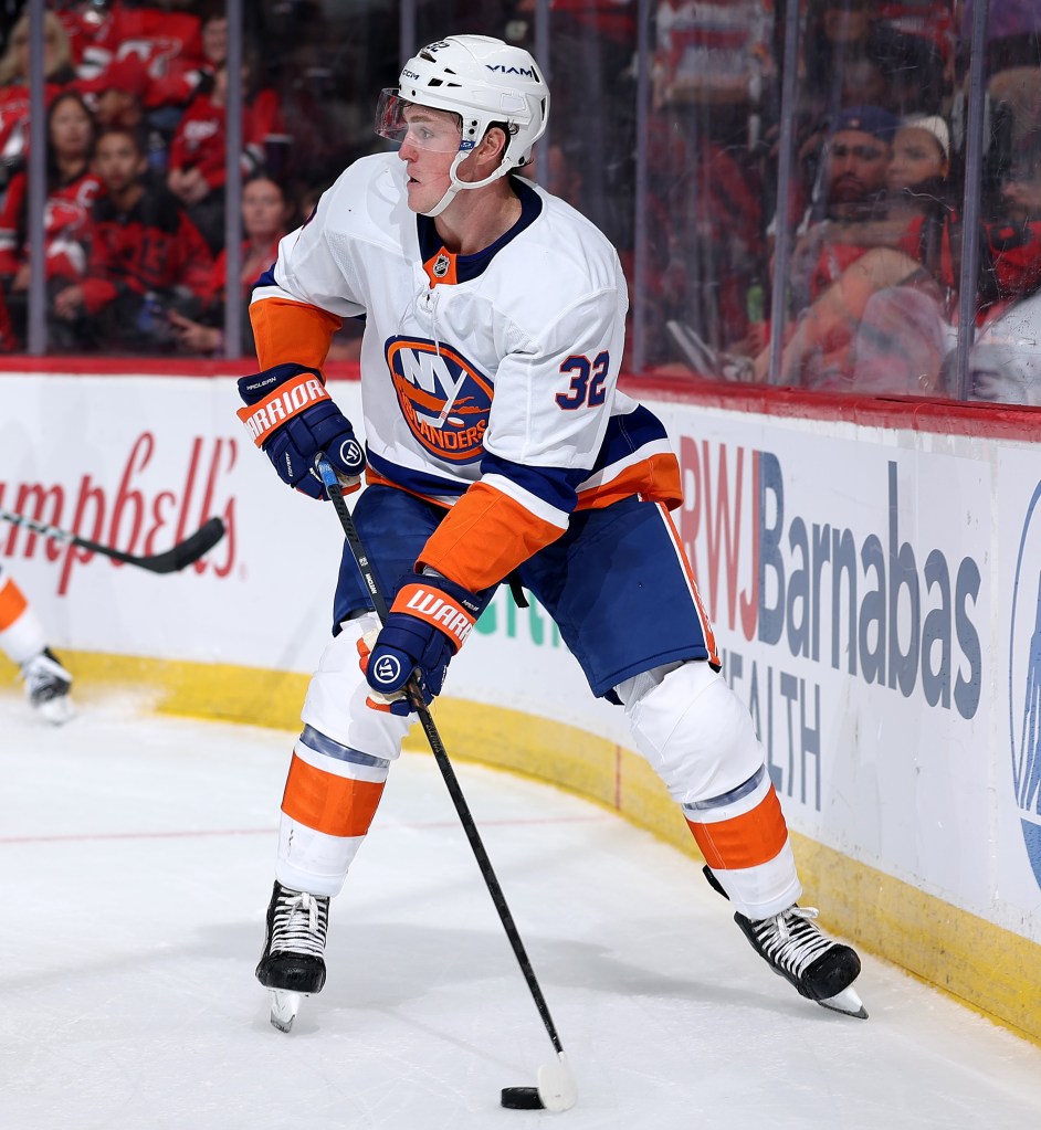 Kyle MacLean plays the puck during the Islanders' 6-2 preseason loss to the Devils on Sept. 23, 2025.