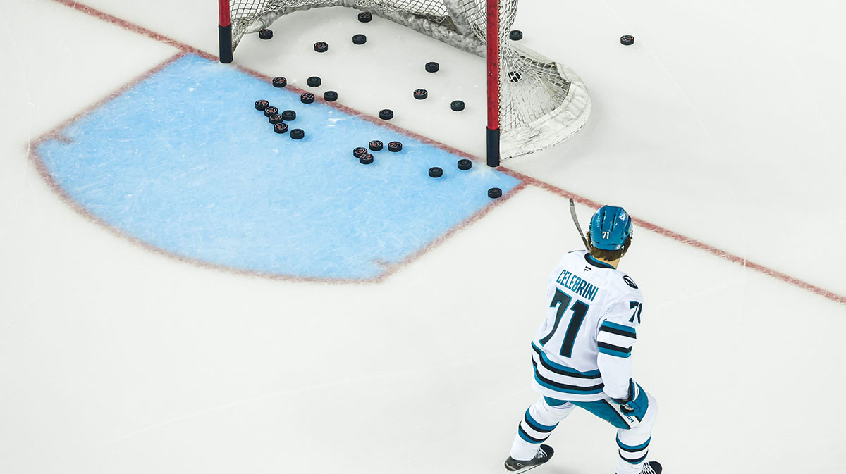 San Jose Sharks center Macklin Celebrini (71) shoots the pucks during the warmup period against the Calgary Flames at Scotiabank Saddledome.