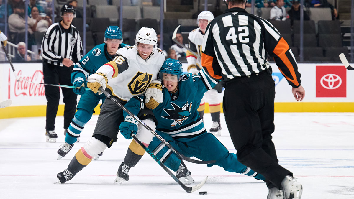 Vegas Golden Knights right wing Jonas Rondbjerg (46) and San Jose Sharks forward Michael Misa (77) vie for the puck during the third period at SAP Center at San Jose. 