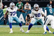 Dallas Cowboys guard Tyler Smith (73) and offensive tackle Tyler Guyton (60) block for...