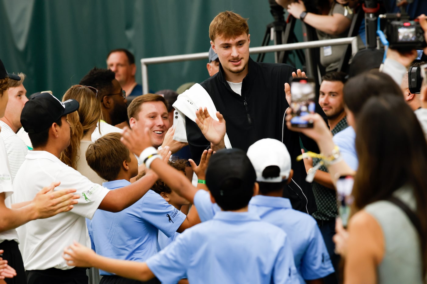 Dallas Mavericks rookie forward Cooper Flagg walks on the court for the 2025 Dirk Nowitzki...