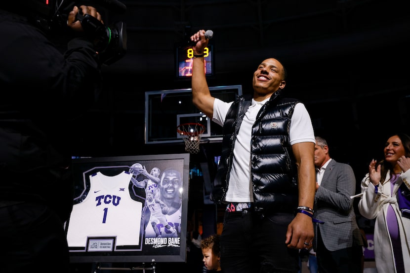 Memphis Grizzlies guard Desmond Bane and TCU alum holds up a mic during his jersey...