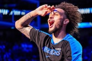 Dallas Mavericks center Dereck Lively II salutes the crowd as his introduced with the...