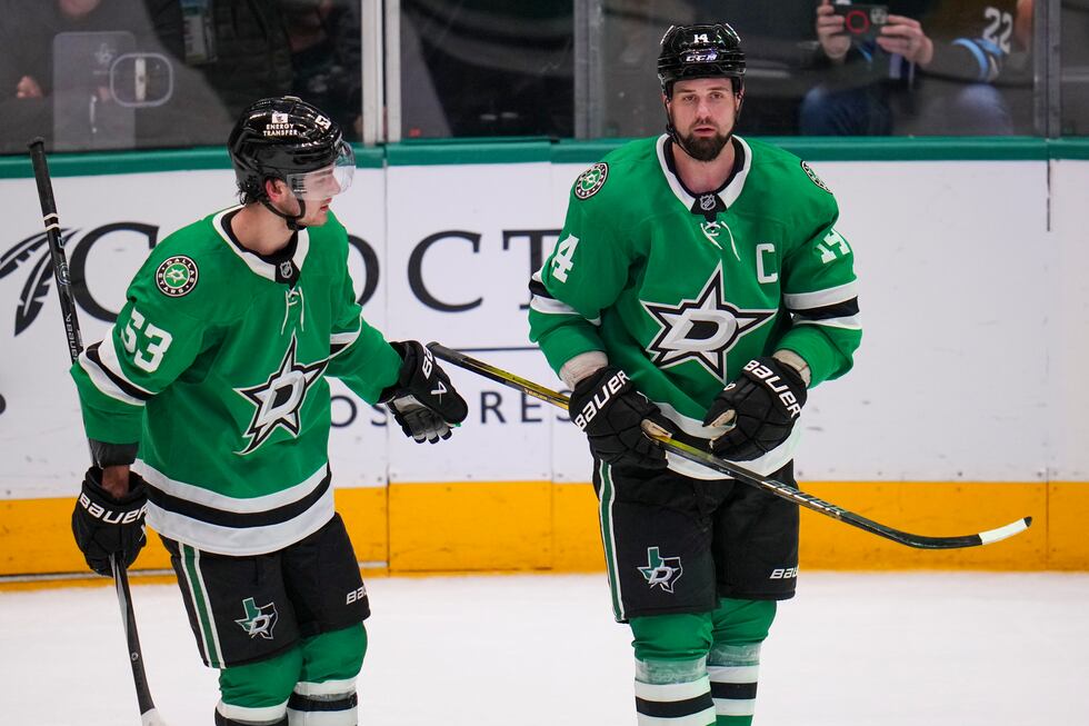 Dallas Stars left wing Jamie Benn, right, and center Wyatt Johnston react after a play against...