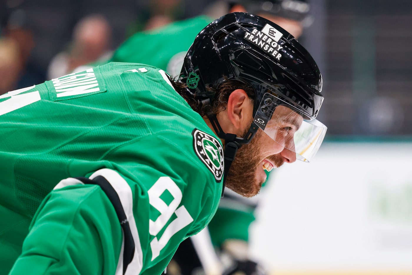 Dallas Stars center Tyler Seguin (91) talks with a Minnesota Wild player before a face-off...
