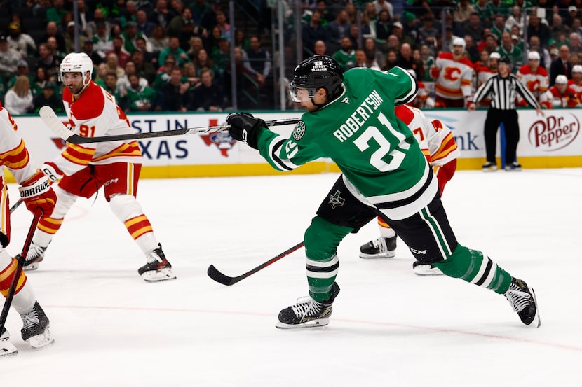Dallas Stars left wing Jason Robertson (21) scores a goal during the third period of an NHL...