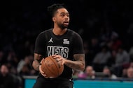 Brooklyn Nets' D'Angelo Russell (1) shoots during the first half of an NBA basketball game...