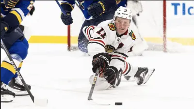 Oliver Moore dives for puck vs St Louis Blues in Tom Kurvers Showcase, September 13, 2025