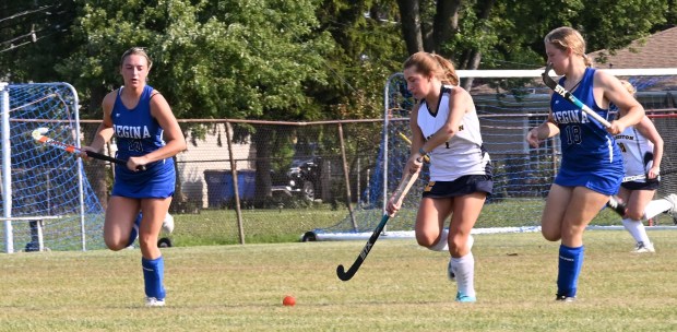 Clarkston (white) and Warren Regina (blue) battled during a non-league game on Monday, Sept. 8, 2025. (DAN STICKRADT -- MediaNews Group)