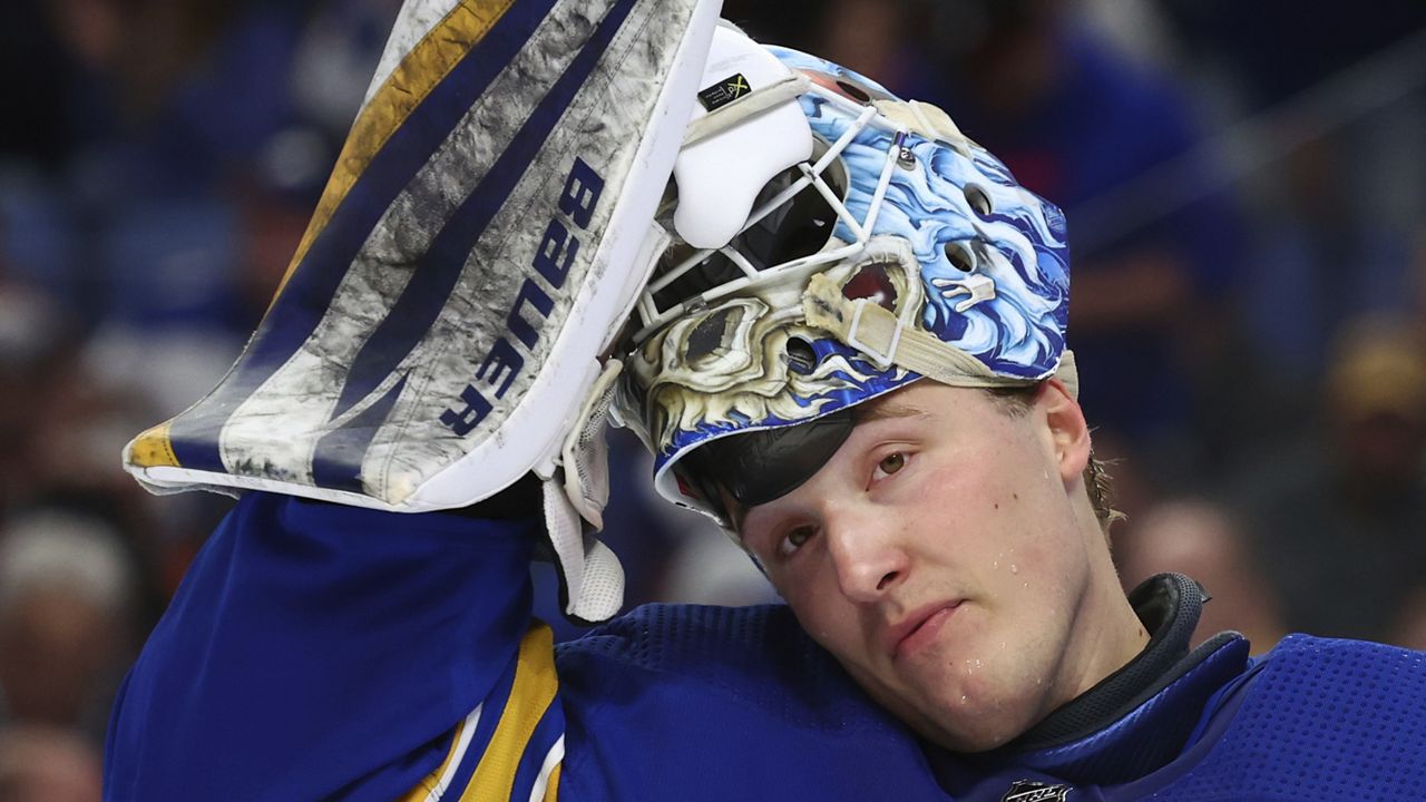 Buffalo Sabres goaltender Ukko-Pekka Luukkonen puts his mask on during the second period of the team's NHL hockey game against the New York Islanders on Thursday, March 14, 2024, in Buffalo, N.Y. (AP Photo/Jeffrey T. Barnes)