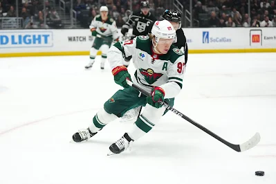 Kirill Kaprizov, Minnesota Wild star forward skates with puck