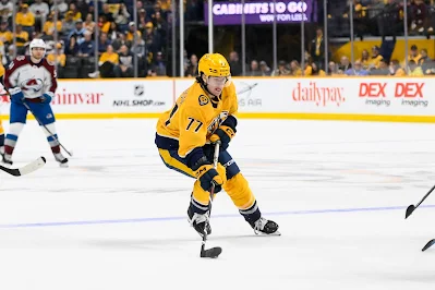 Luke Evangelista, Nashville Predators forward Luke Evangelista, Nashville Predators forward, skates with puck