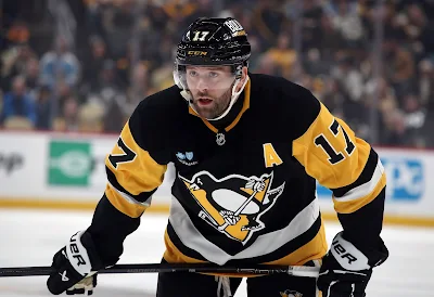 Pittsburgh Penguins forward Bryan Rust reacts during 2025 game.