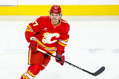 Connor Zary skates for Calgary Flames during game