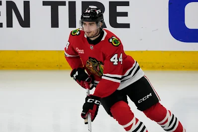 Wyatt Kaiser, Chicago Blackhawks defenseman, skates with puck