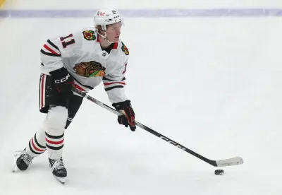 Apr 8, 2025; Pittsburgh, Pennsylvania, USA; Chicago Blackhawks center Oliver Moore (11) skates with the puck against the Pittsburgh Penguins during the second period at PPG Paints Arena. Mandatory Credit: Charles LeClaire-Imagn Images