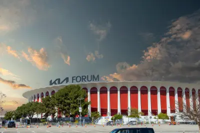 A beautiful spring landscape at the Kia Forum with lush green trees and plants and powerful clouds at sunset in Inglewood California USA