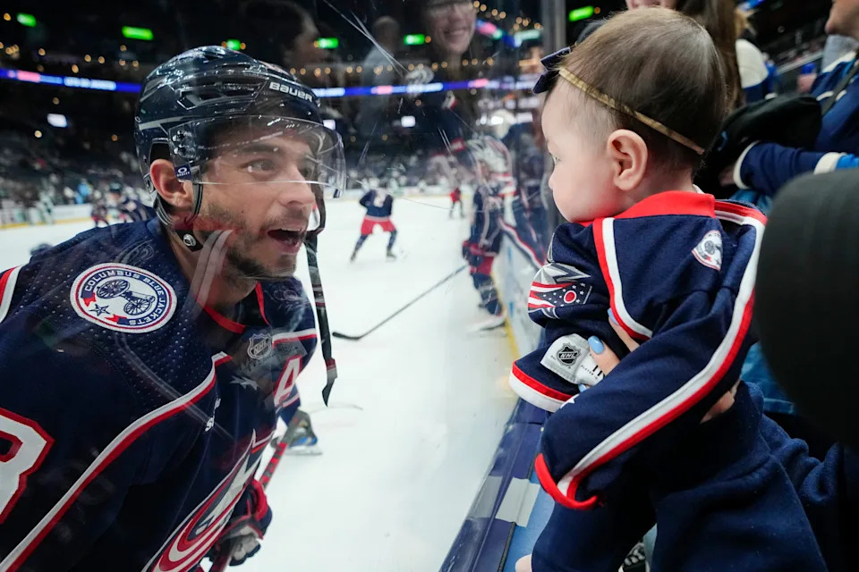Mar 3, 2023; Columbus, Ohio, USA; Columbus Blue Jackets left wing Johnny Gaudreau (13) smiles at his daughter, Noa, prior to the NHL hockey game against the Seattle Kraken at Nationwide Arena.