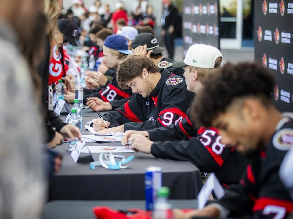 A large group of players took time to sign autographs for fans Sunday at Fan Fest.