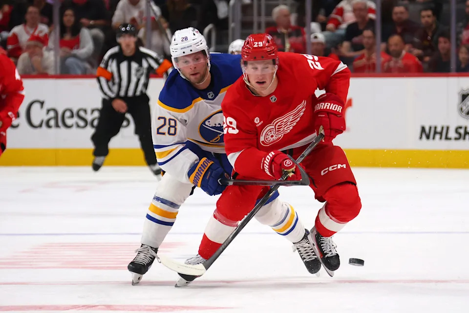 Nate Danielson of the Detroit Red Wings heads up ice in front of Zac Jones of the Buffalo Sabres during the second period in a preseason game at Little Caesars Arena on September 25, 2025 in Detroit.