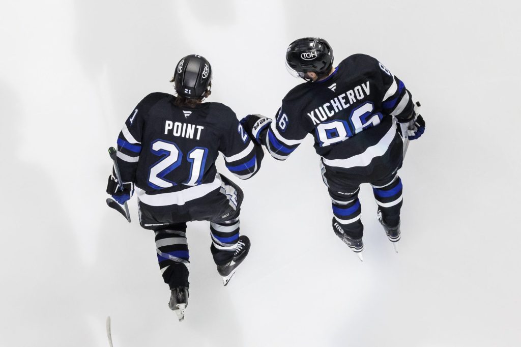 Brayden Point and Nikita Kucherov of the Tampa Bay Lightning in between whistles.