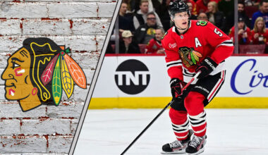 Chicago Blackhawks defenseman Connor Murphy skates during an NHL game, with the Blackhawks logo visible in the background, sparking NHL trade rumors discussions.